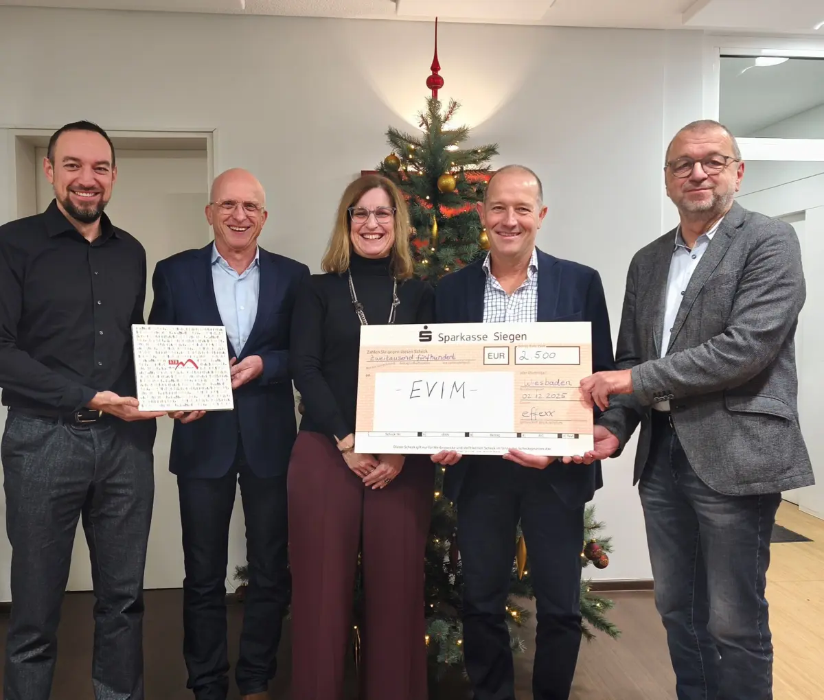 Spendenübergabe an Evim.